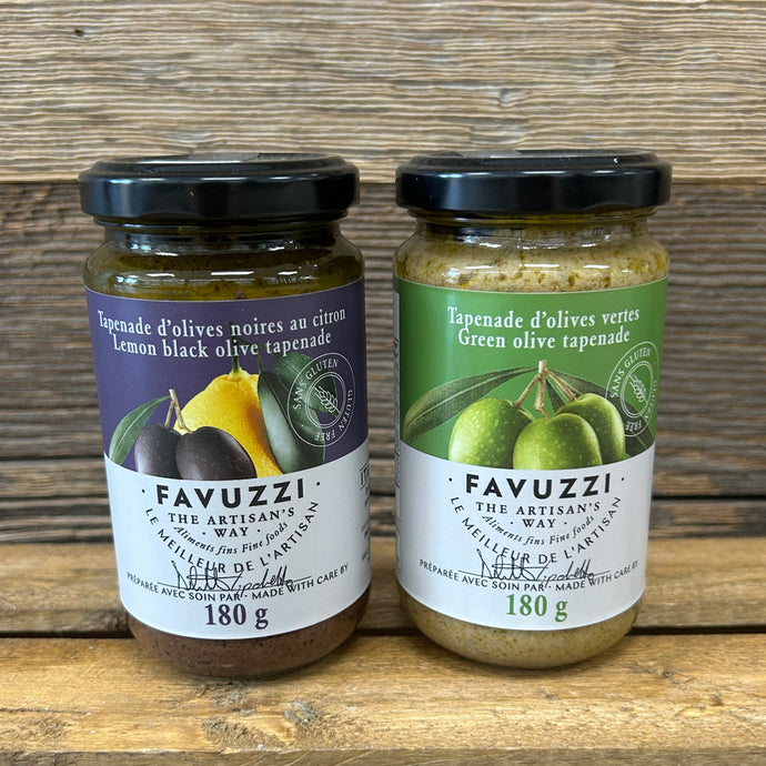 Two jars of Favuzzi olive tapenade on a wooden surface