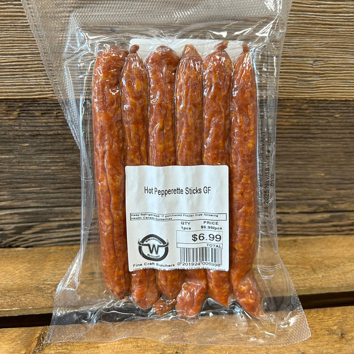 Packaged pepperettes on a wooden surface