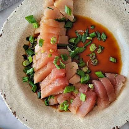 A plate of raw tuna sashimi