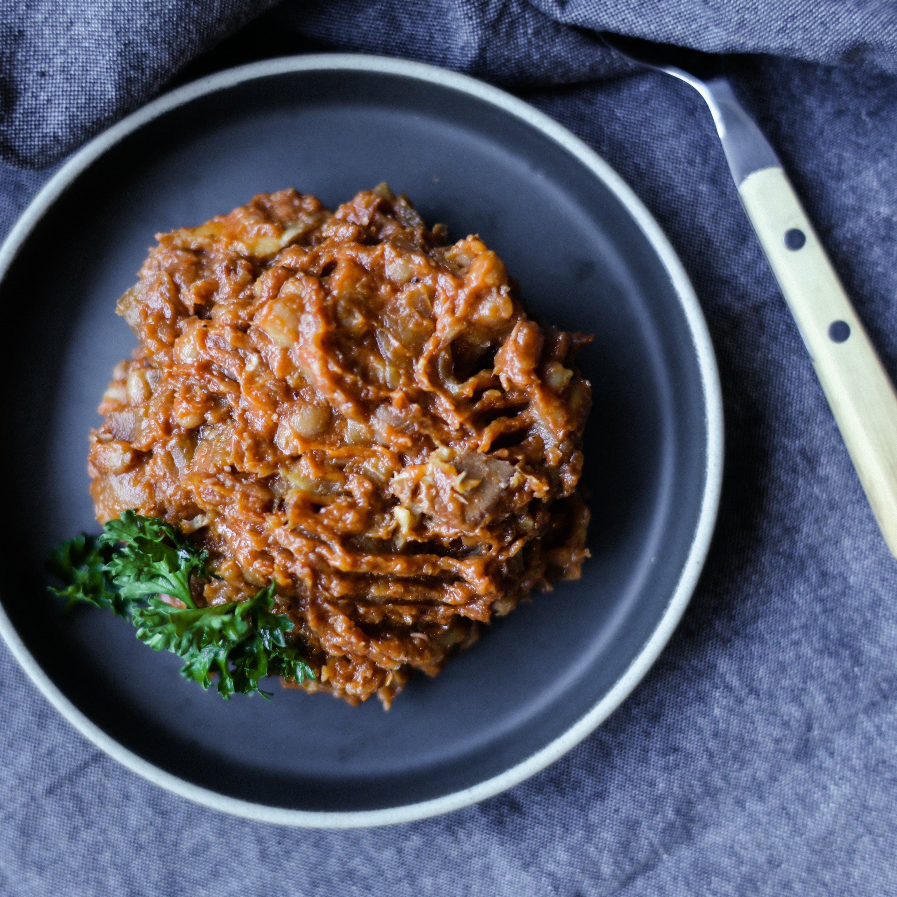 bowl of baked beans with bacon