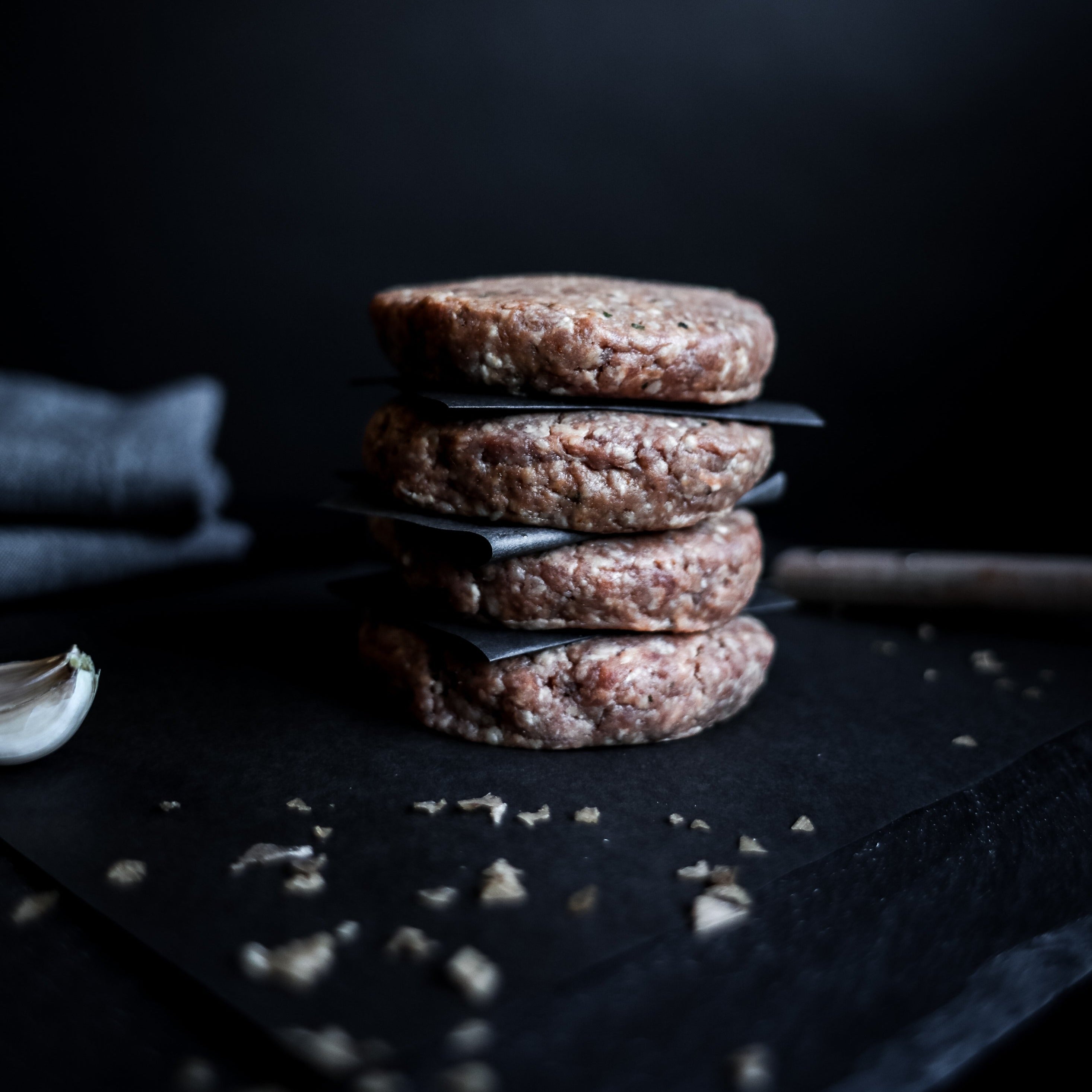 stack of four beef hamburgers