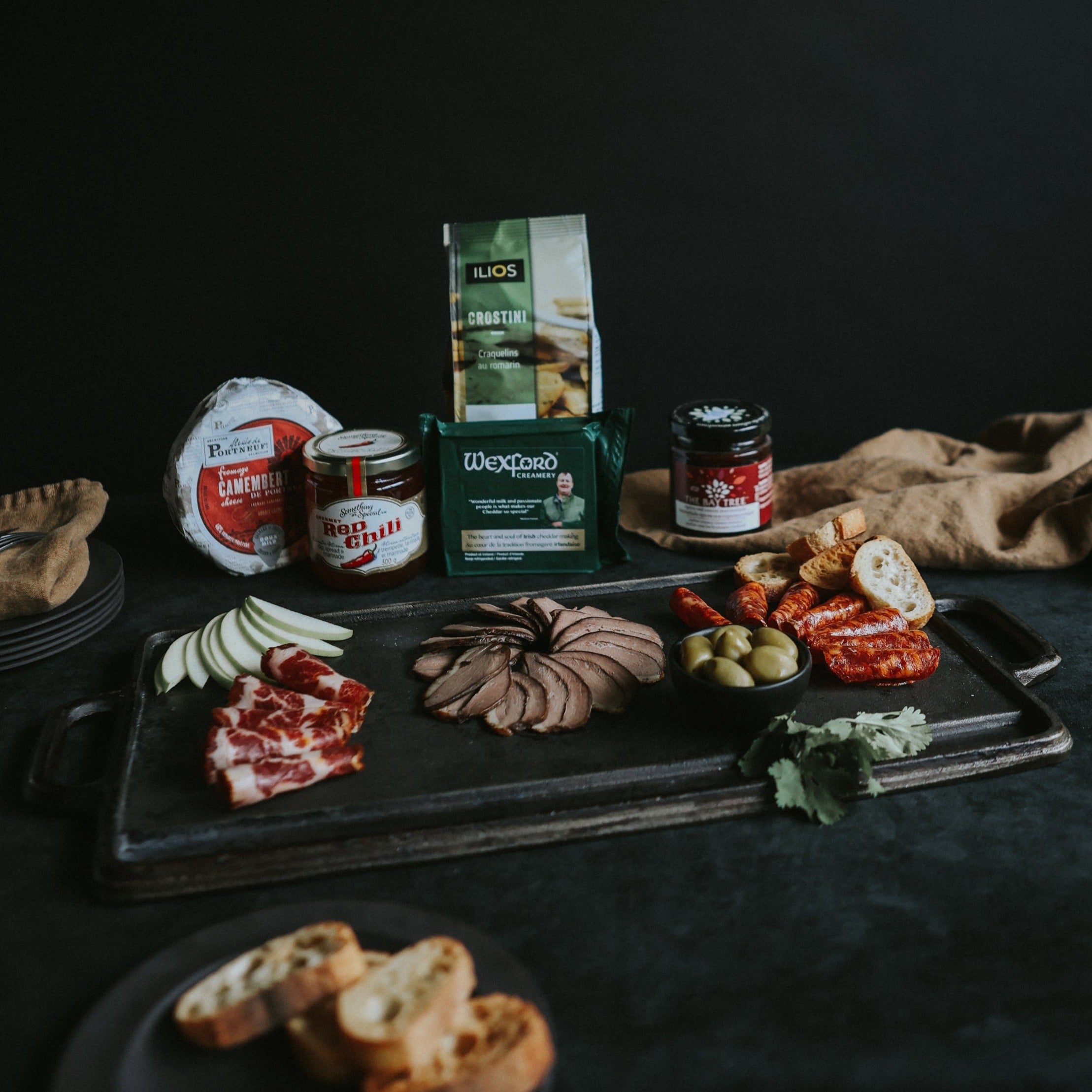 charcuterie tray with assorted deli meats and cheeses